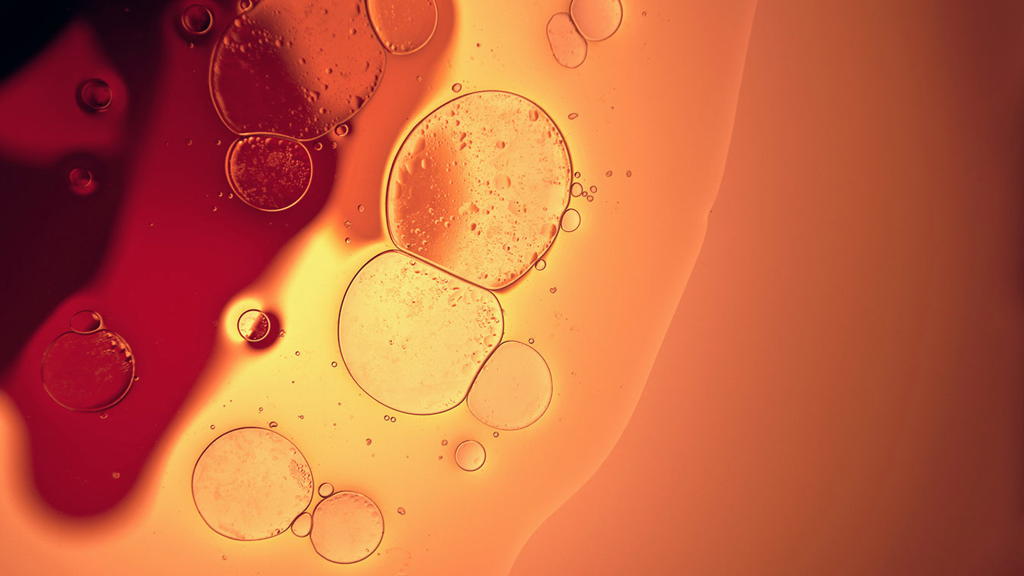 Orange and amber liquid with bubbles