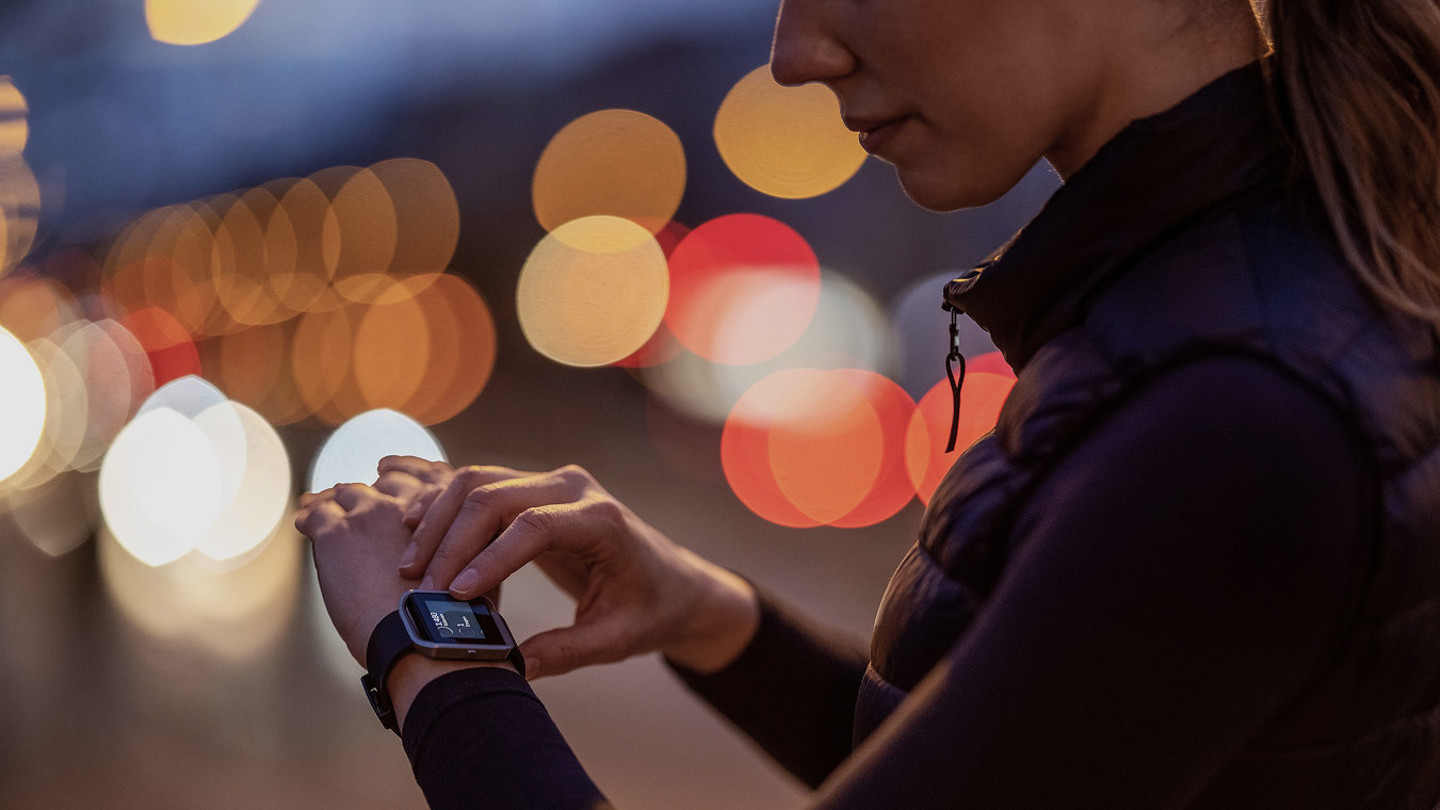 Woman checking a smartwatch on her wrist