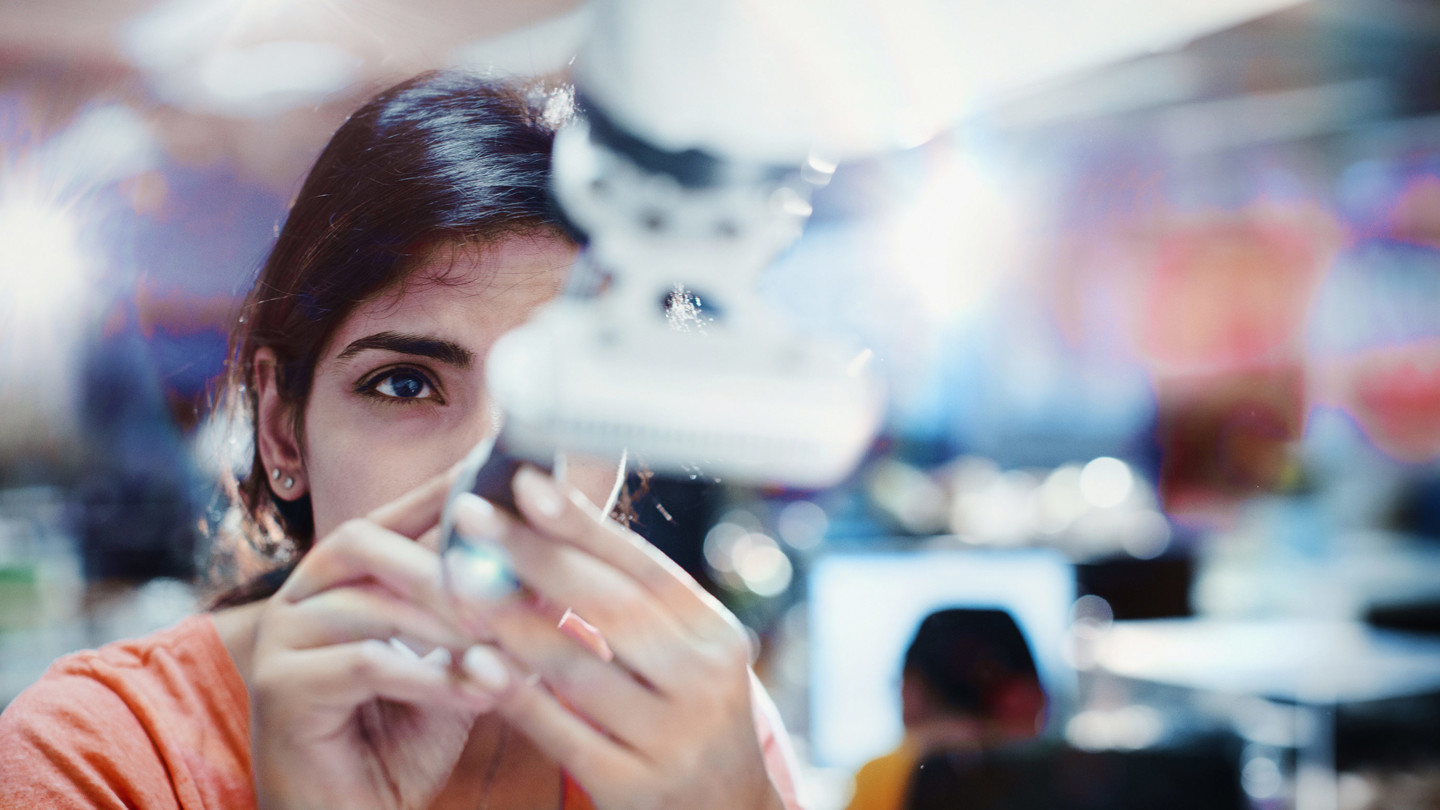 Woman handling scientific machineary